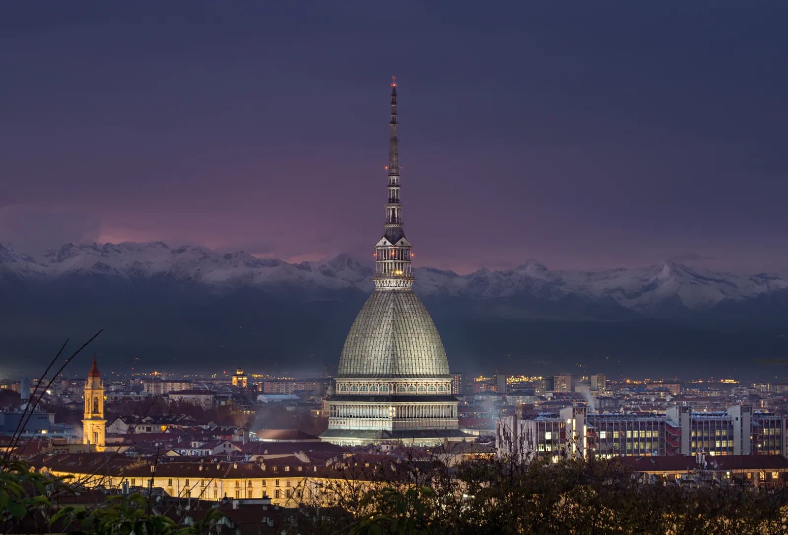 The Mole Antonelliana at dusk, the symbol of Turin.